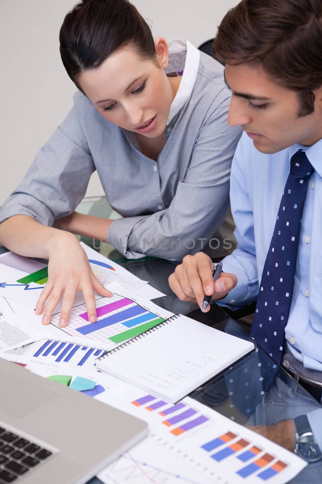 Young business team analyzing charts