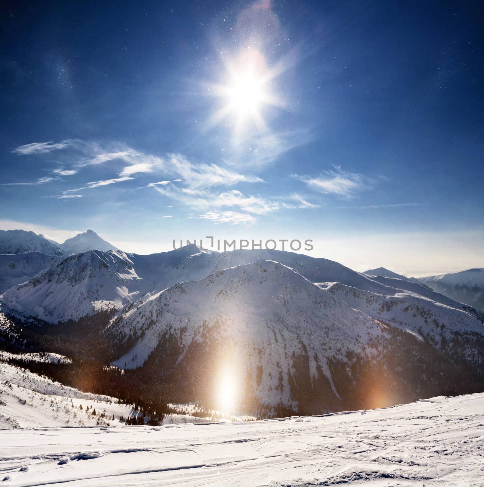 Crystalline snow sparkles in the winter sun. Polish Tatras. Zakopane.