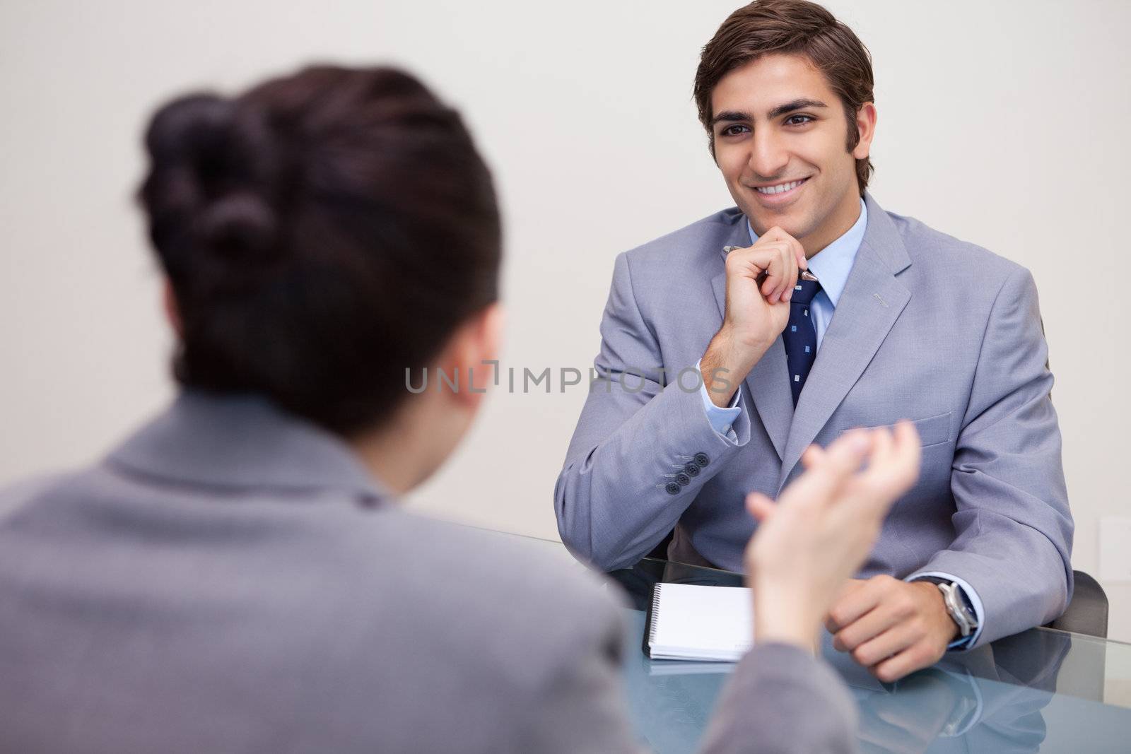 Smiling young businessman in a negotiation