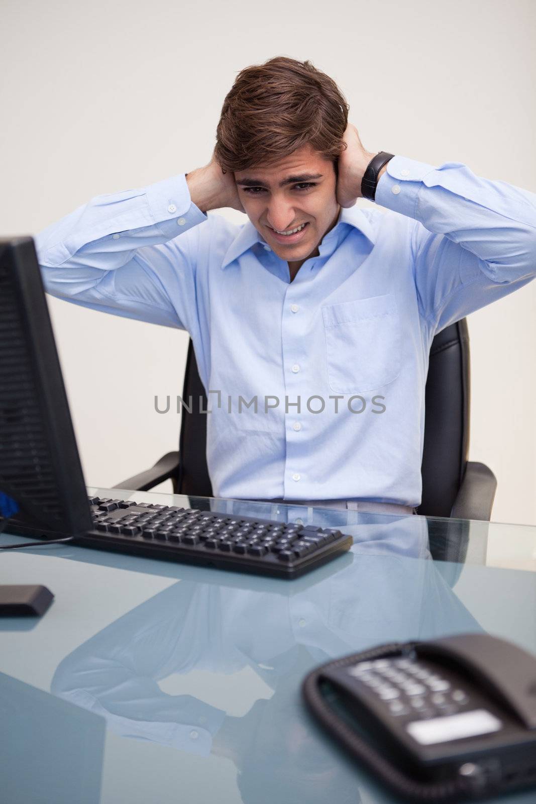 Businessman having pain in his ears by Wavebreakmedia