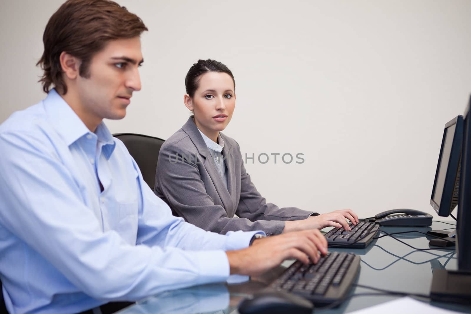 Side view of young business team working on their computers