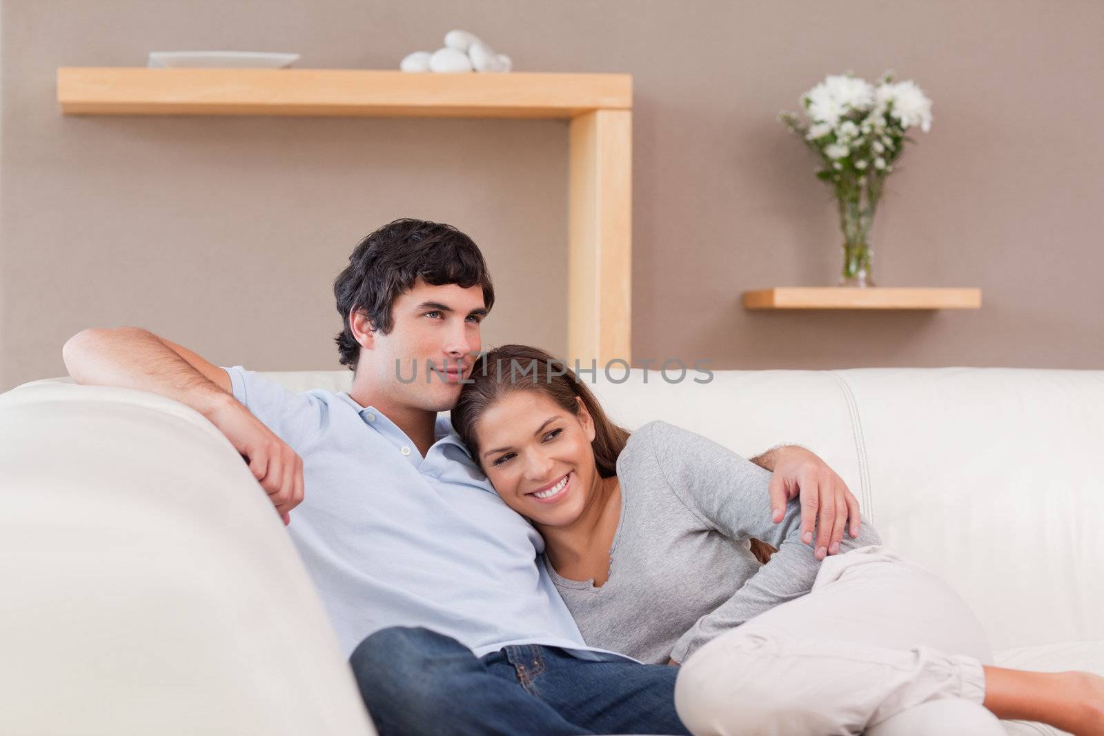 Young couple being together on the sofa