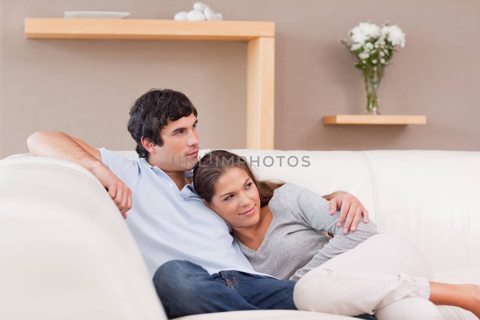 Young couple being together on the couch