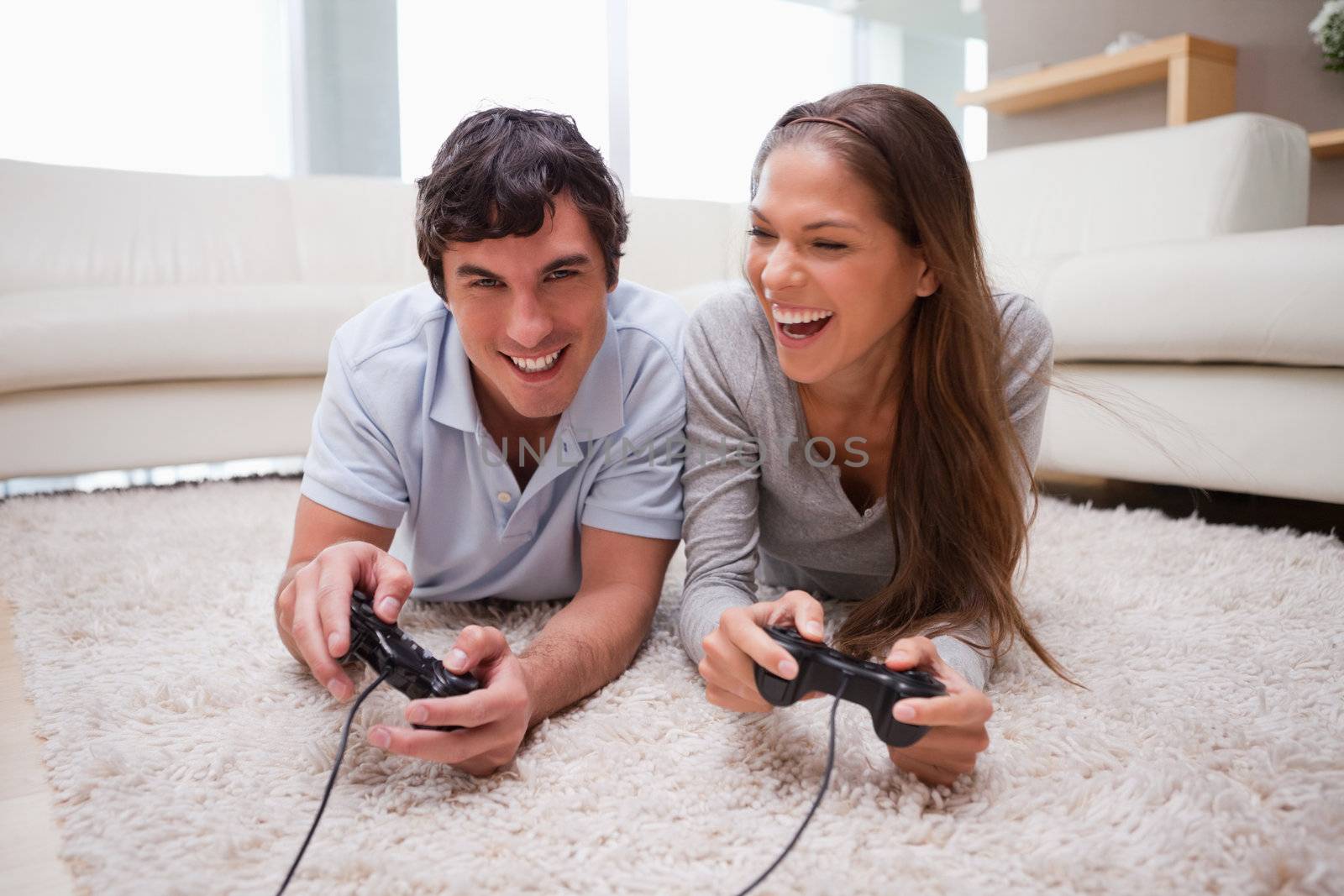 Young couple playing video games together