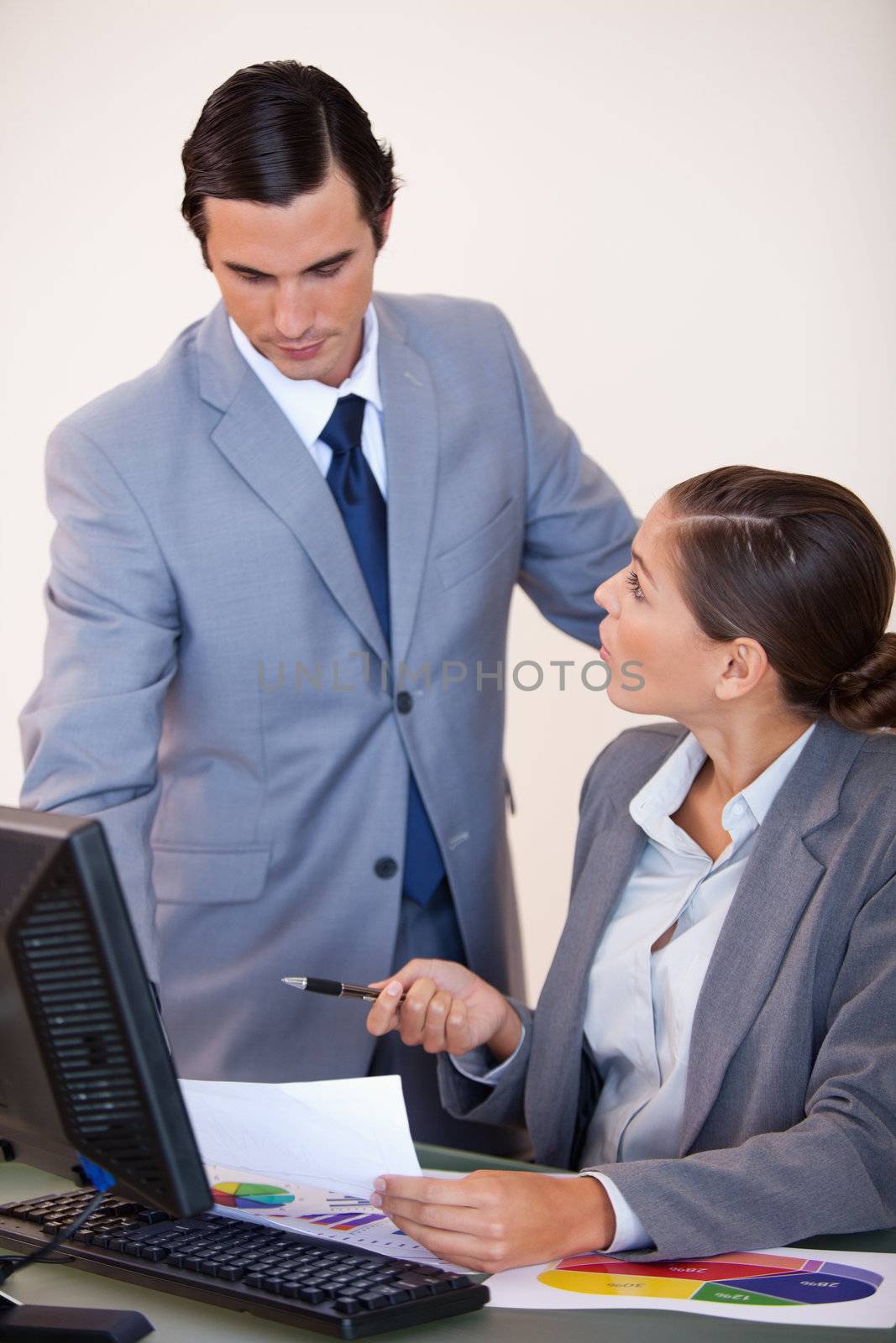 Young businessman talking with his secretary