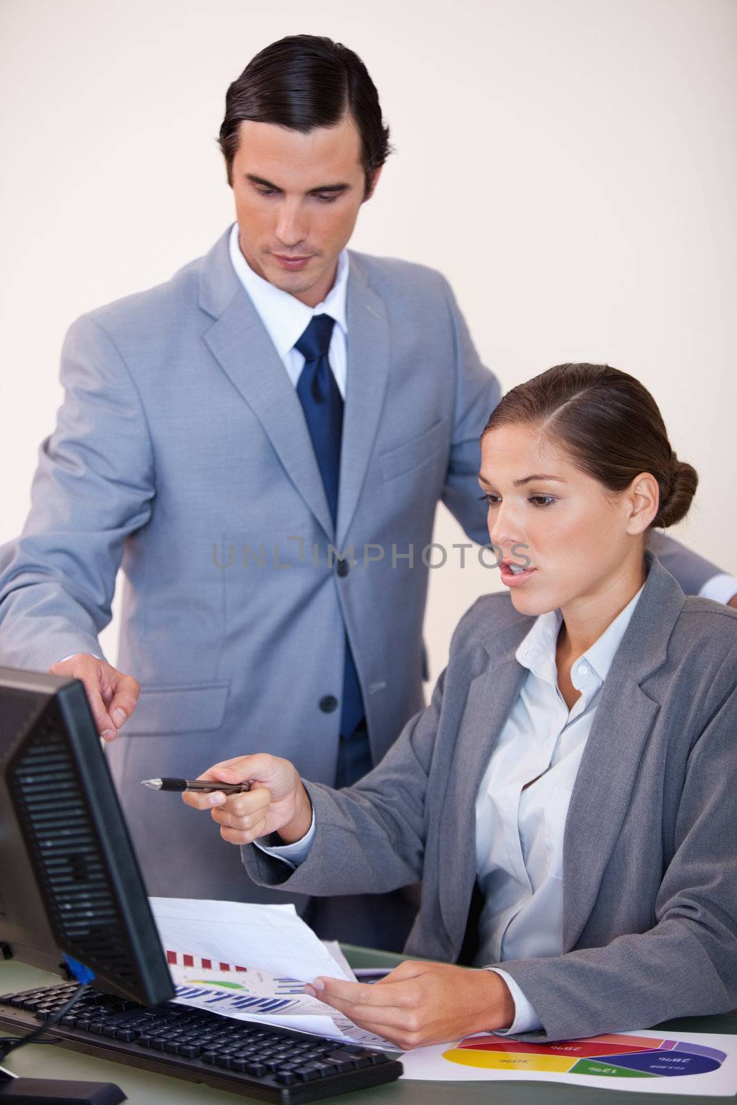 Young businessman talking with secretary