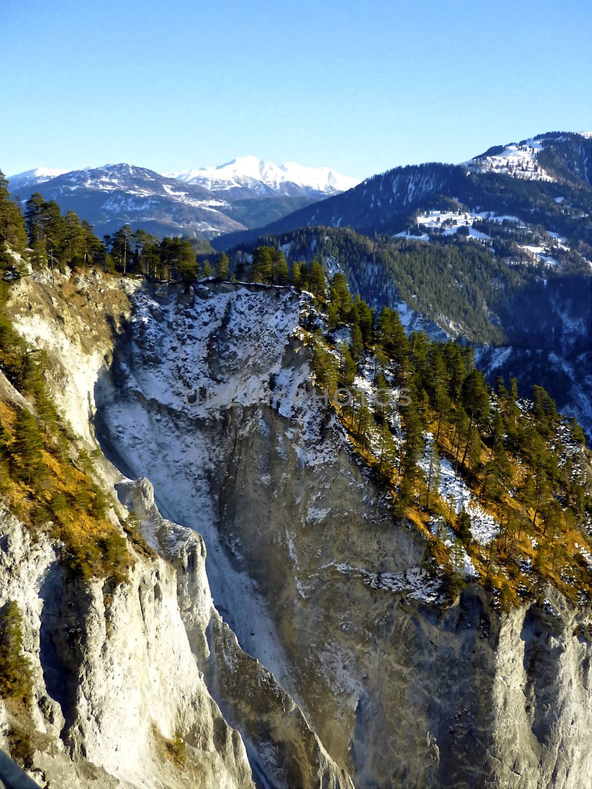 Graubuenden or Grisons, the largest and easternmost canton of Switzerland. Forest and mountains, painting effect.