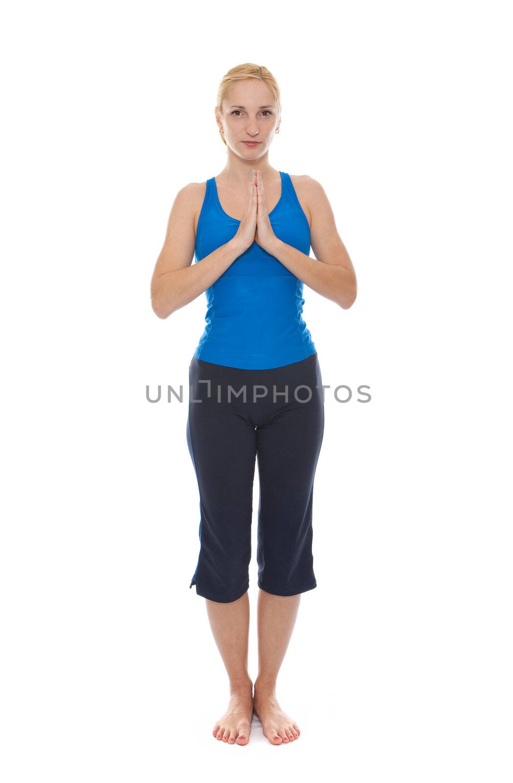 Practicing Yoga. Young woman isolated on white background