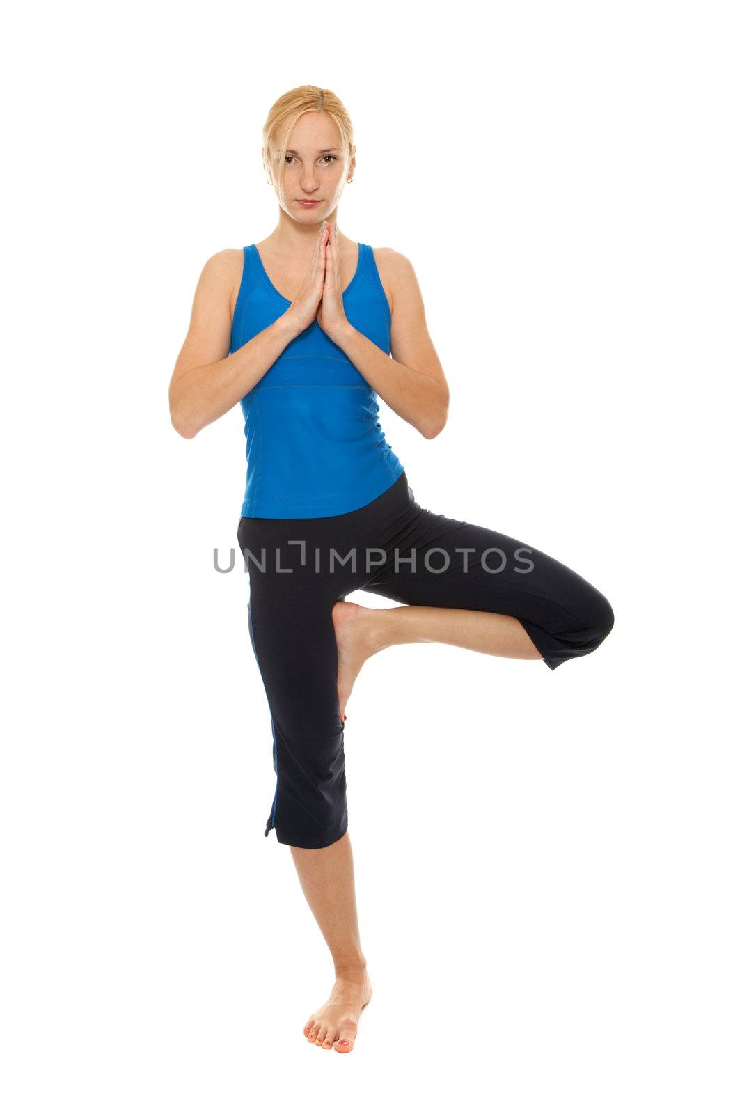 Practicing Yoga. Young woman by bloodua