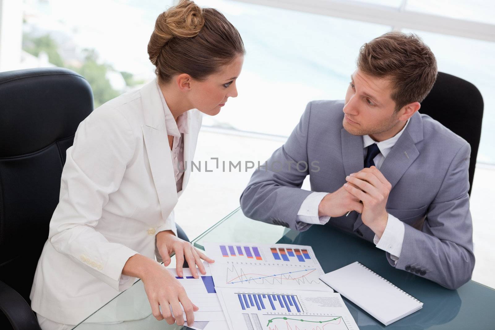Business team deliberating on market research results