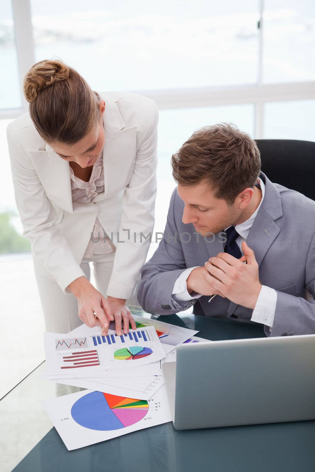 Businesswoman explaining research results to colleague