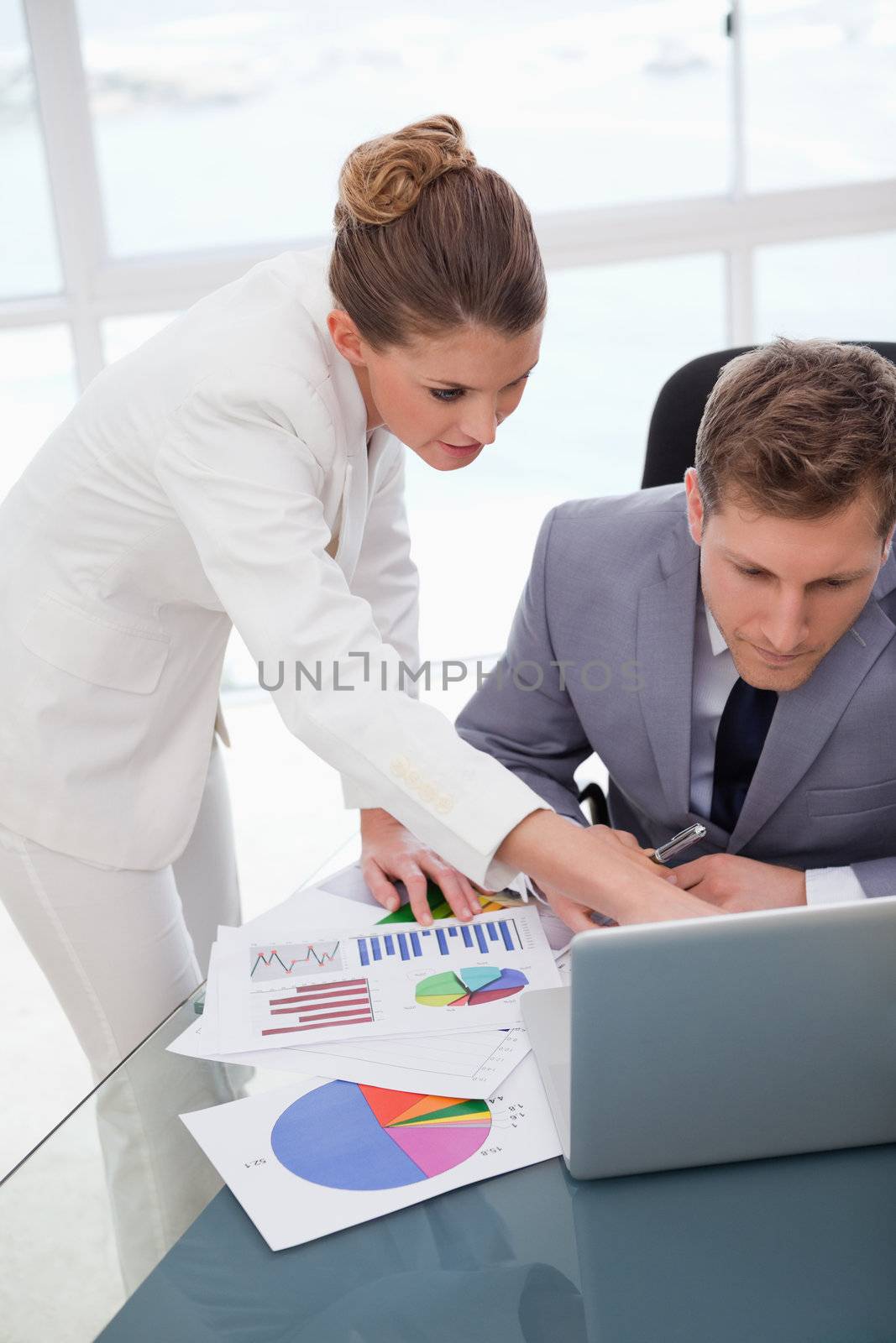 Business team working on survey results together