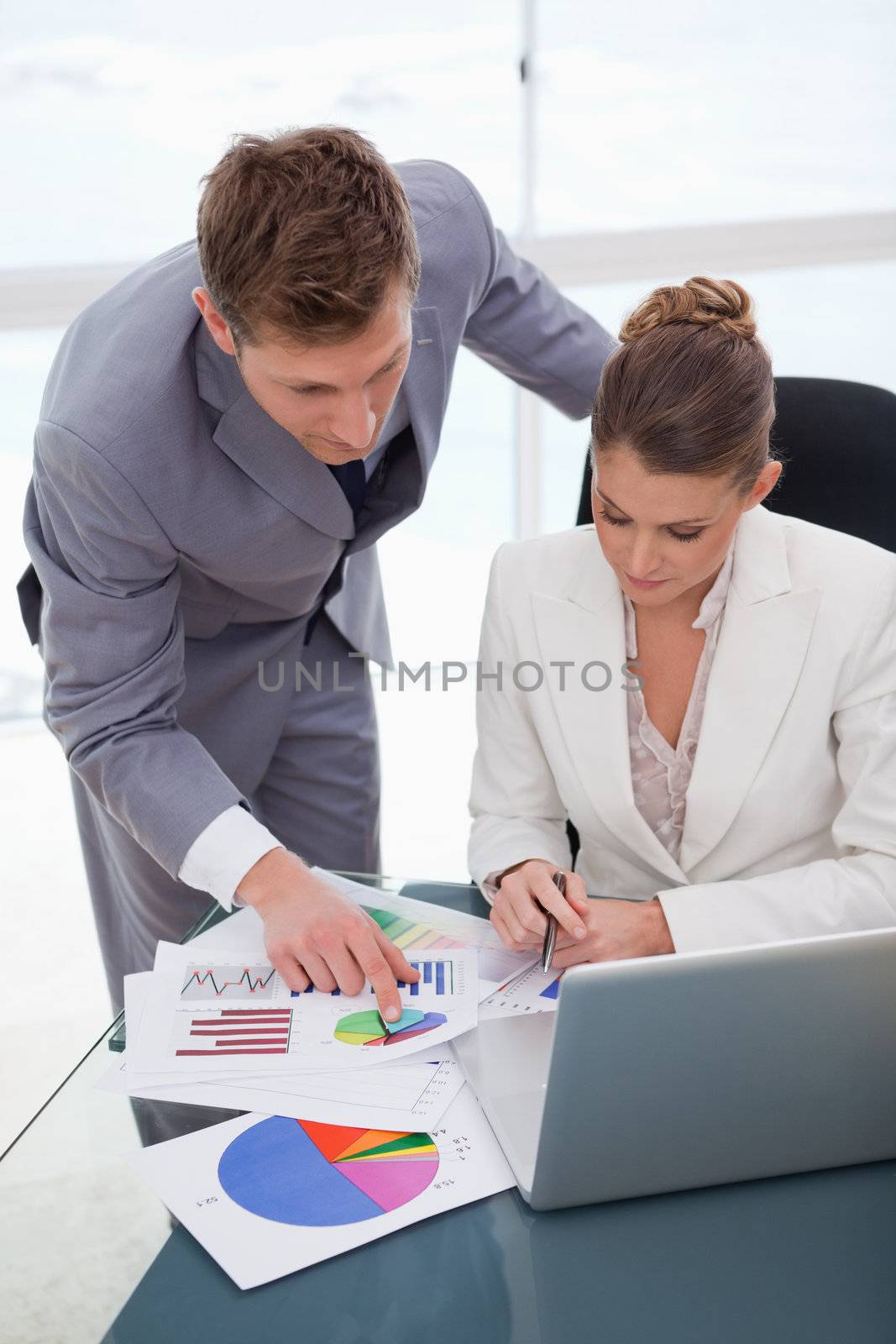 Business team analyzing survey results together