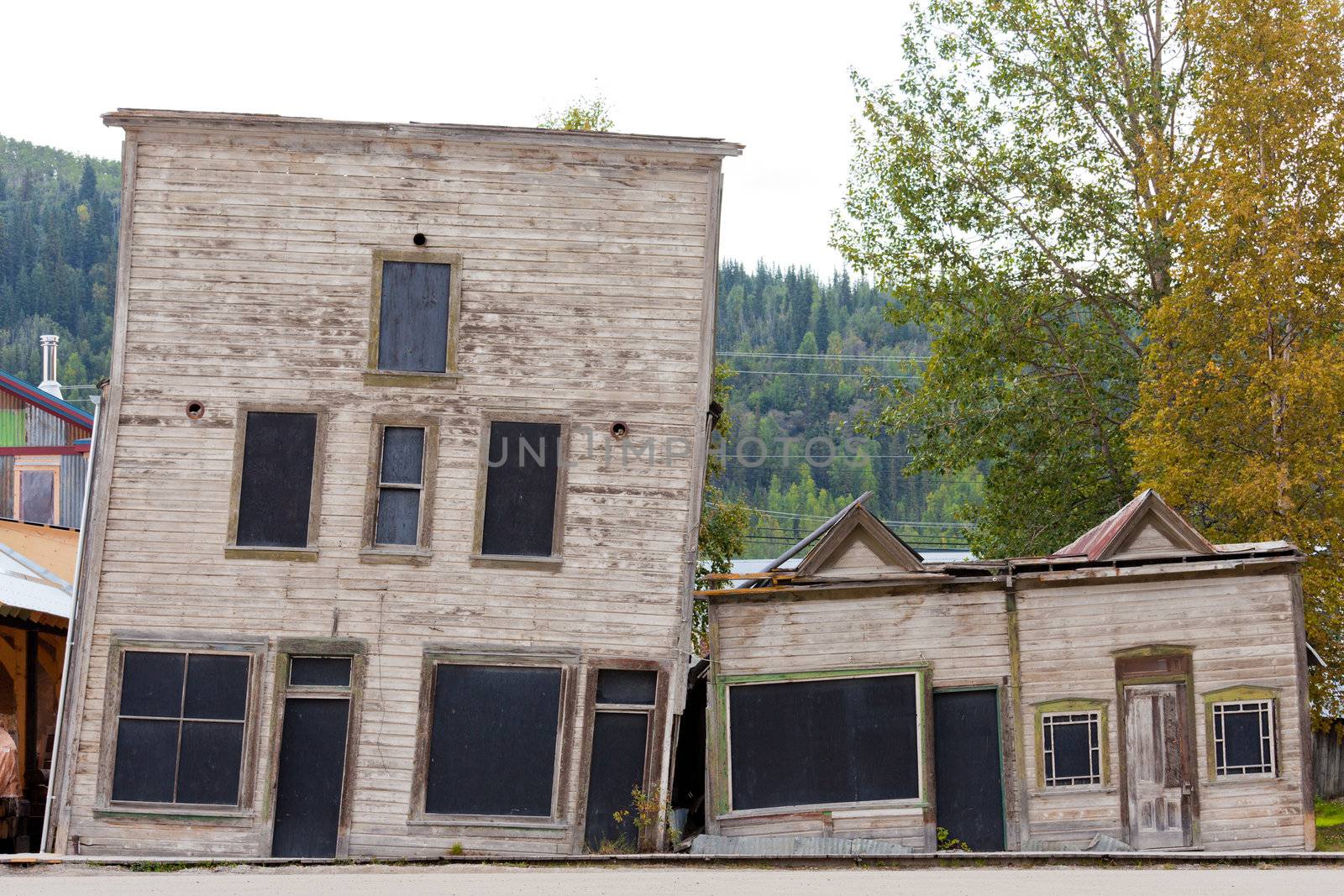 Goldrush heritage buildings in Dawson City, Yukon Territory, Canada, with foundations on melting permafrost making them slant