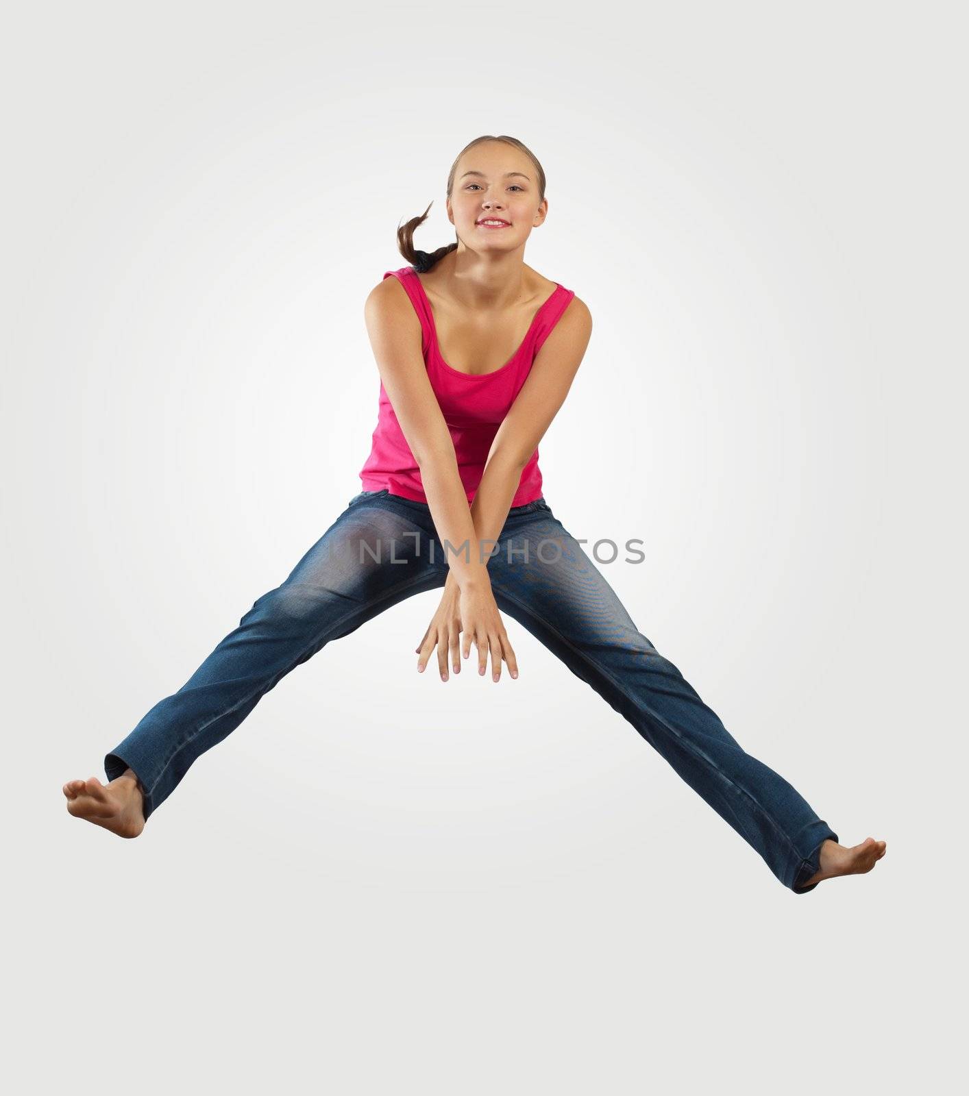 young woman playing on electro guitar and jumping