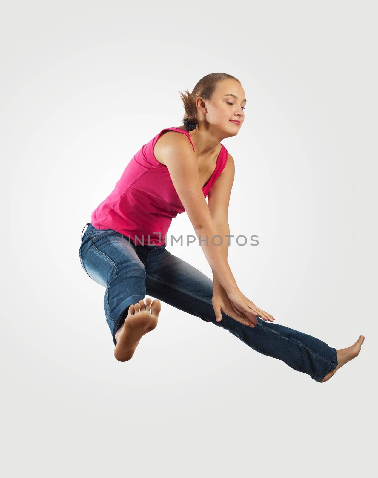 young woman playing on electro guitar and jumping