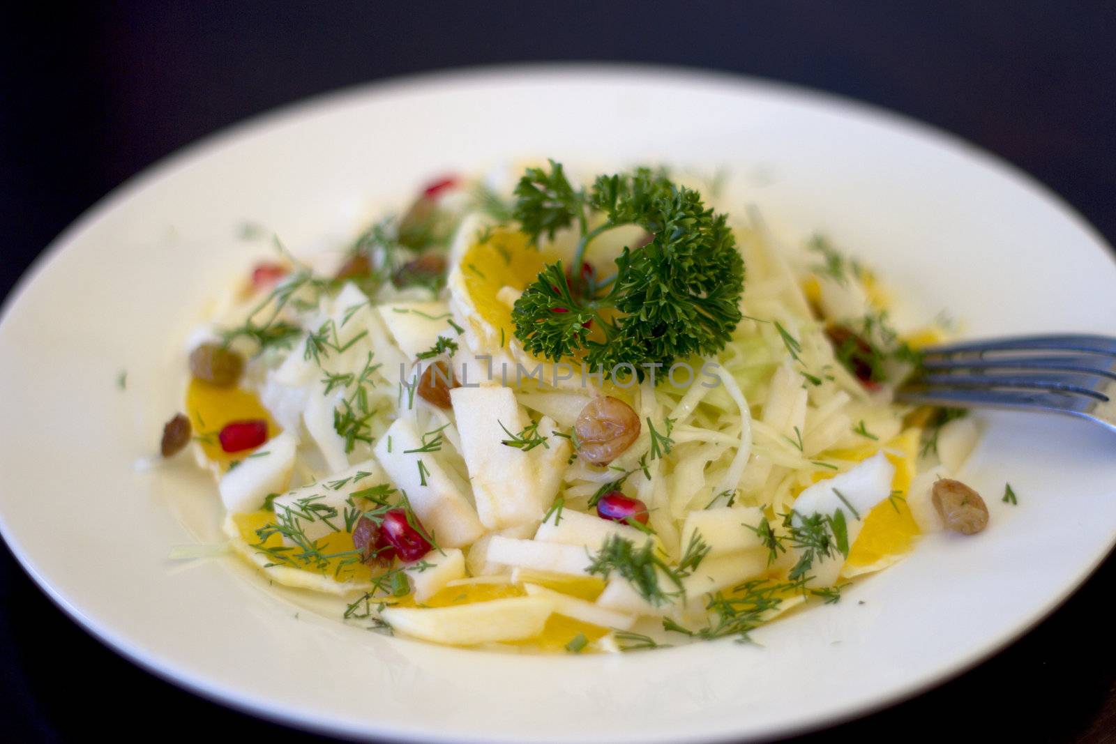 Mixed vegetables on  a plate against dark background