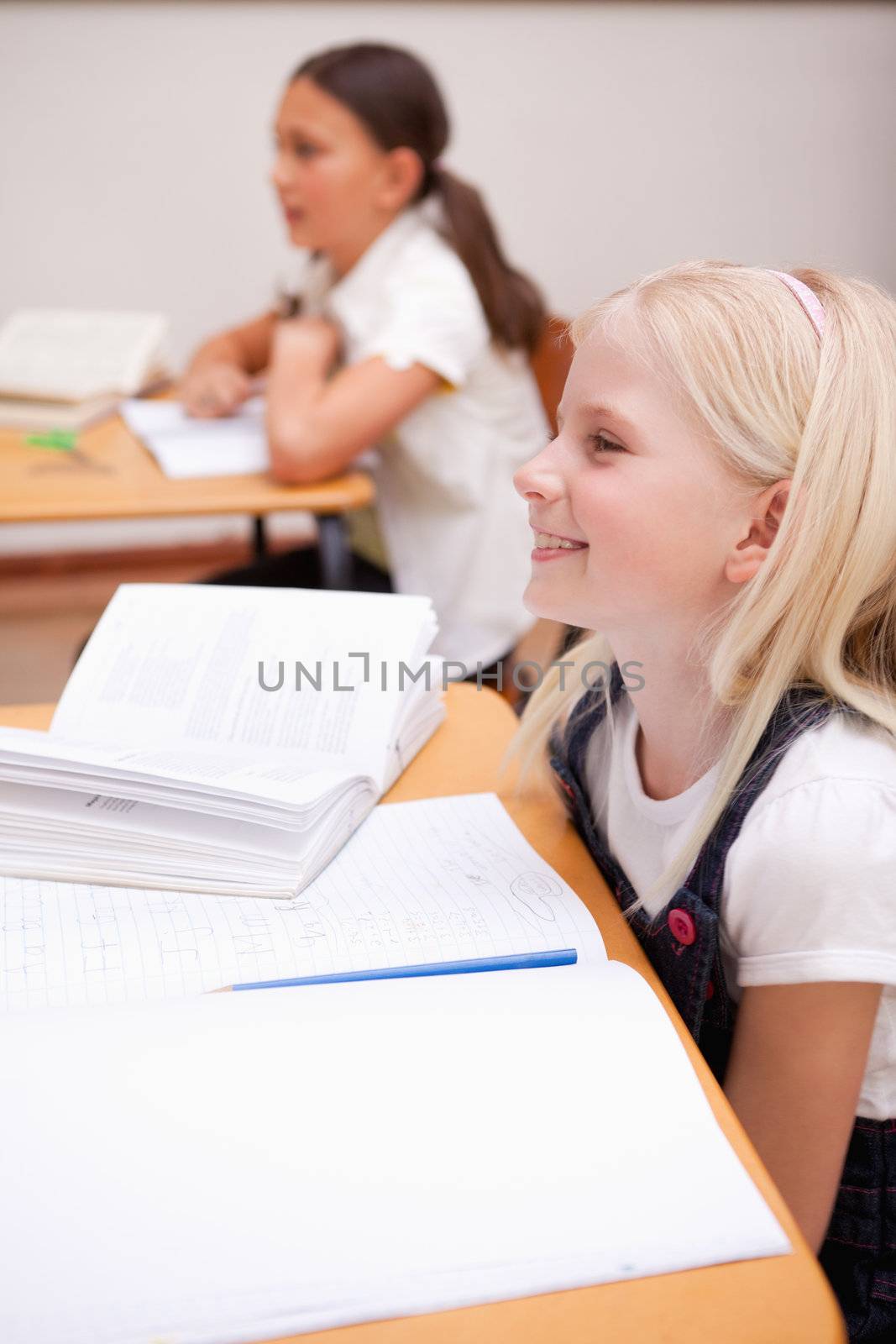 Portrait of pupils smiling in a classroom