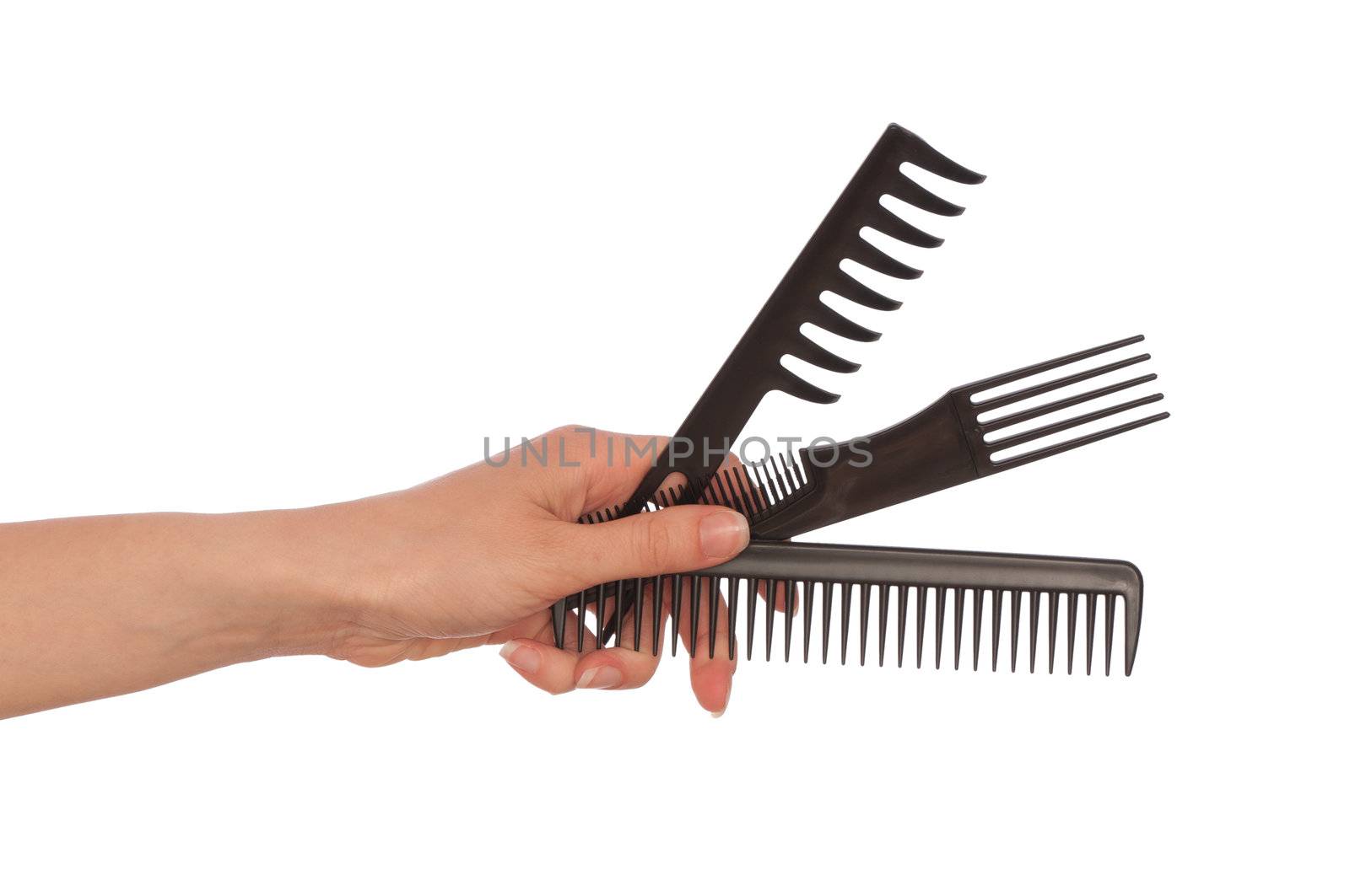 hairdresser holds the black tools for haircut