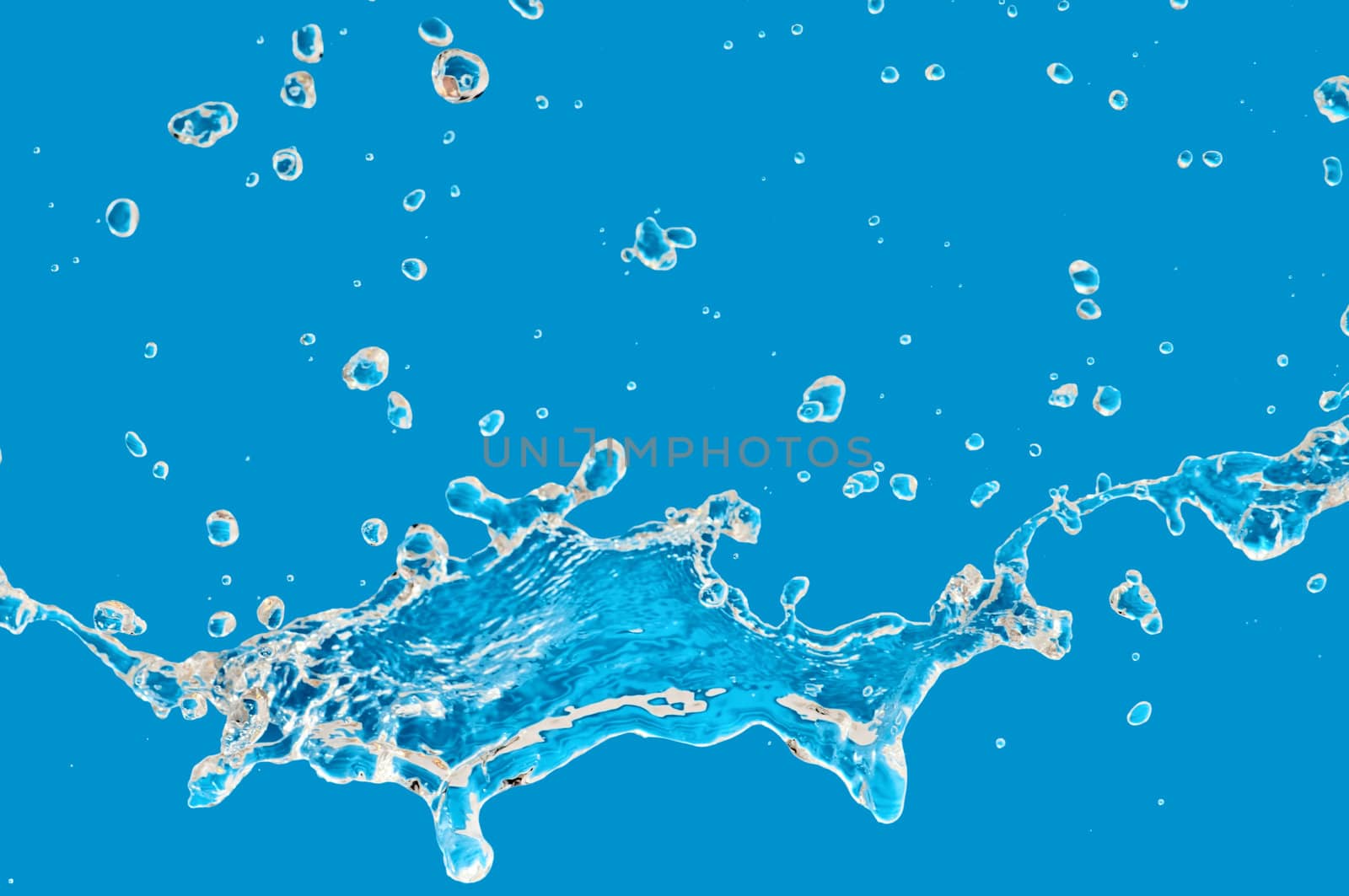 pouring fresh tropical blue sea water in a glass aquarium