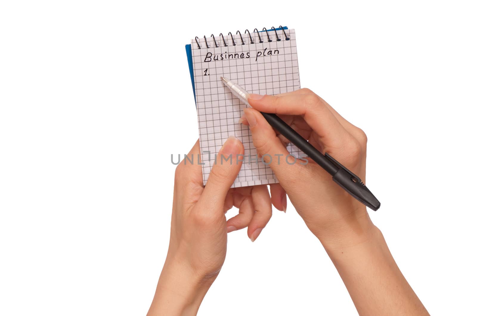 business woman writes notes for business plan