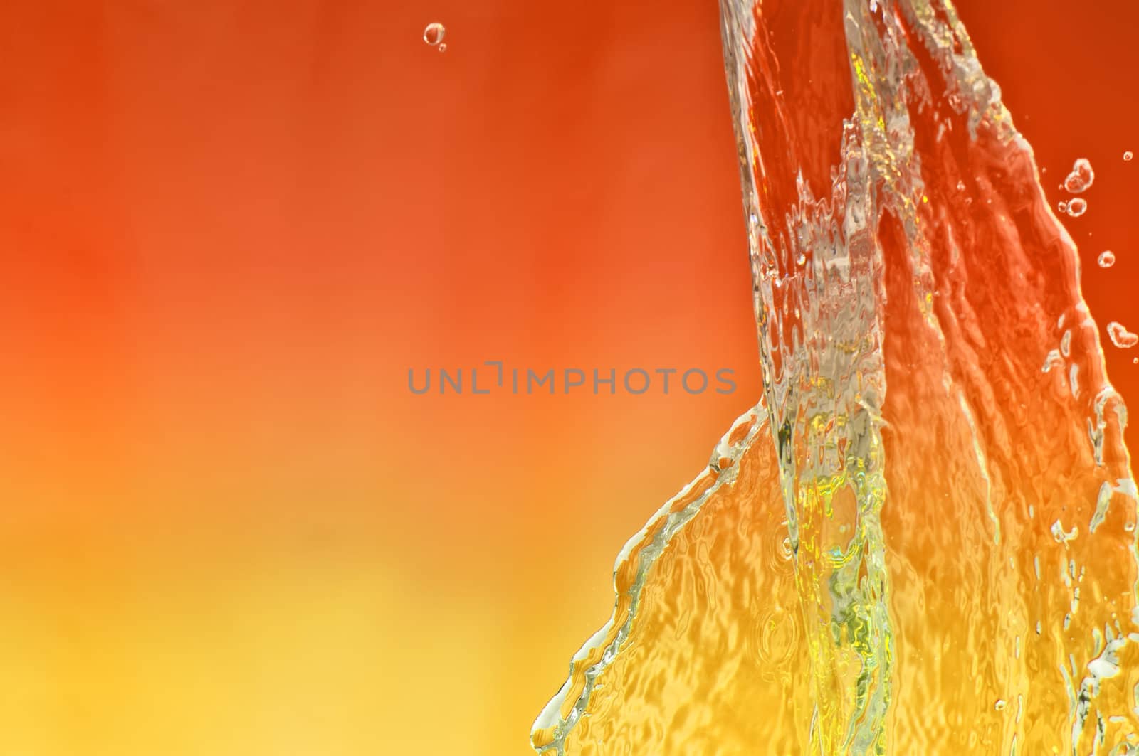 splash fresh tropical sea water in a glass aquarium with red lamp
