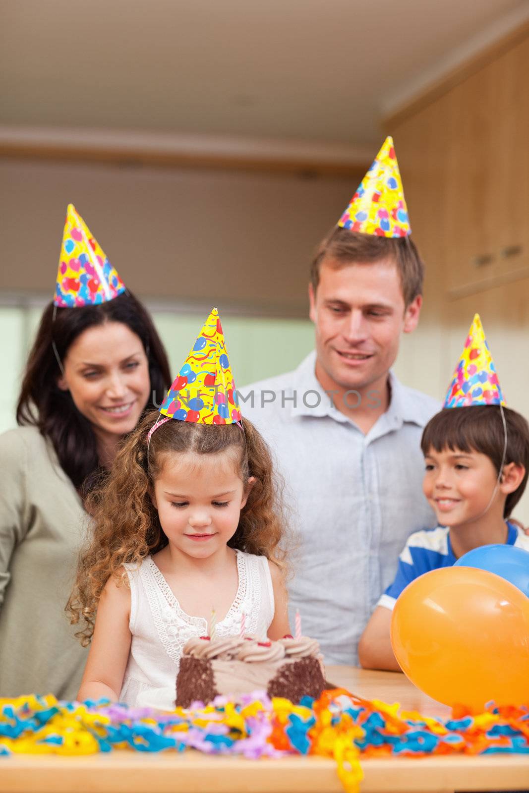 Happy family celebrating daughters birthday by Wavebreakmedia