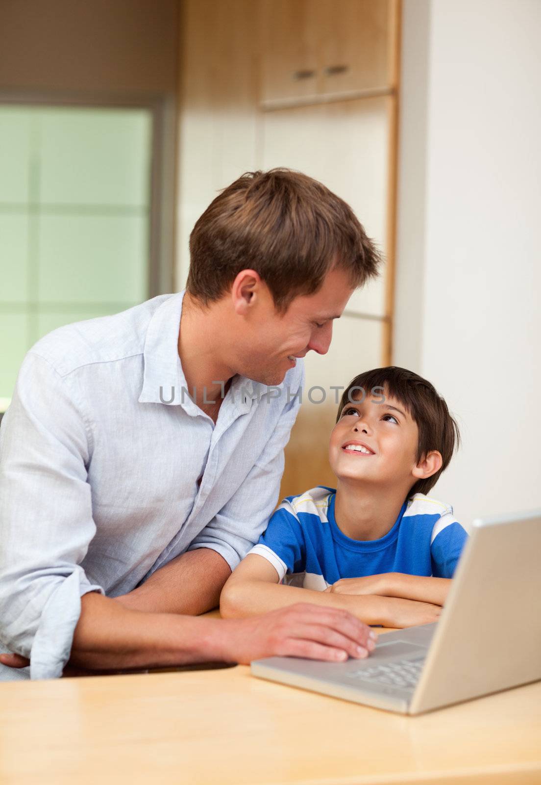 Father and son with laptop by Wavebreakmedia