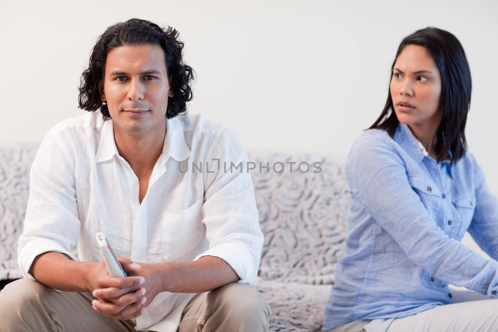 Young couple having a dispute in the living room