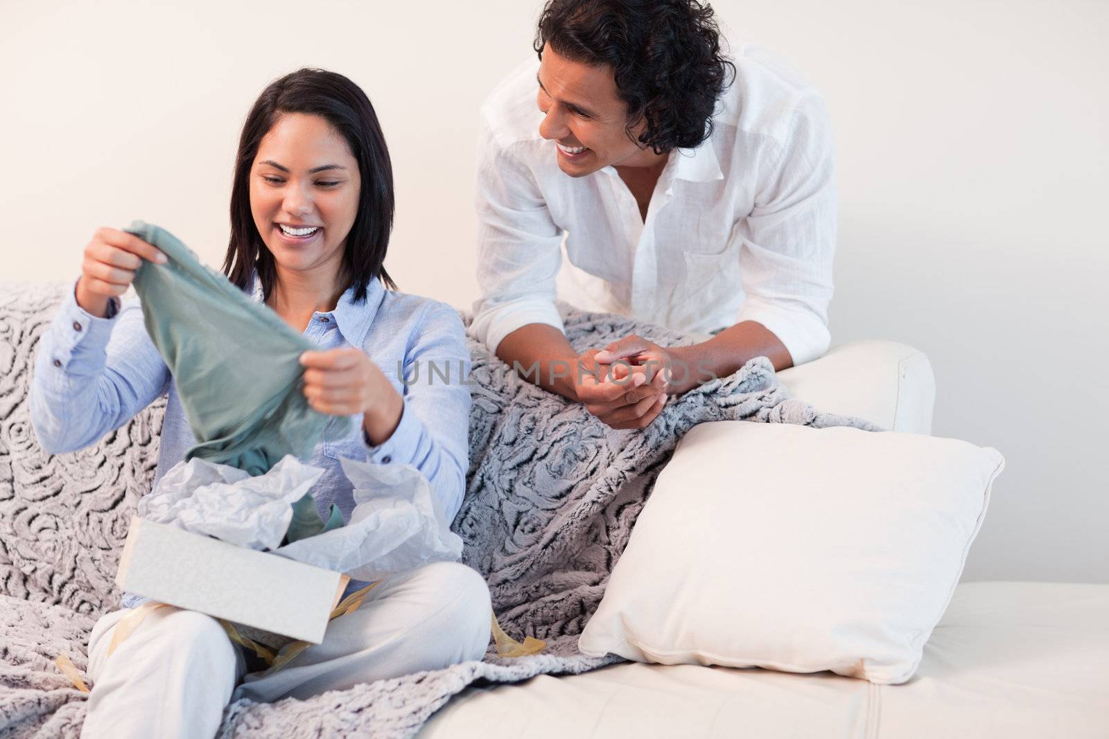 Young woman just opened the present she got from her boyfriend