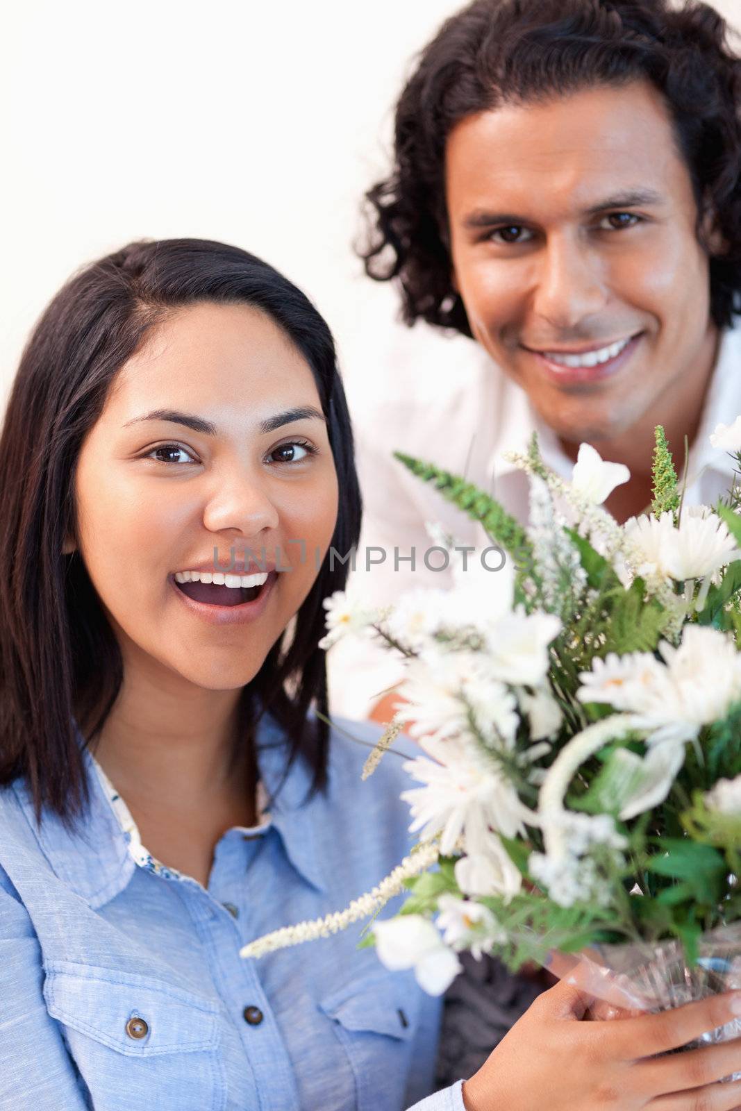 Young woman holding the bouquet she got from her boyfriend