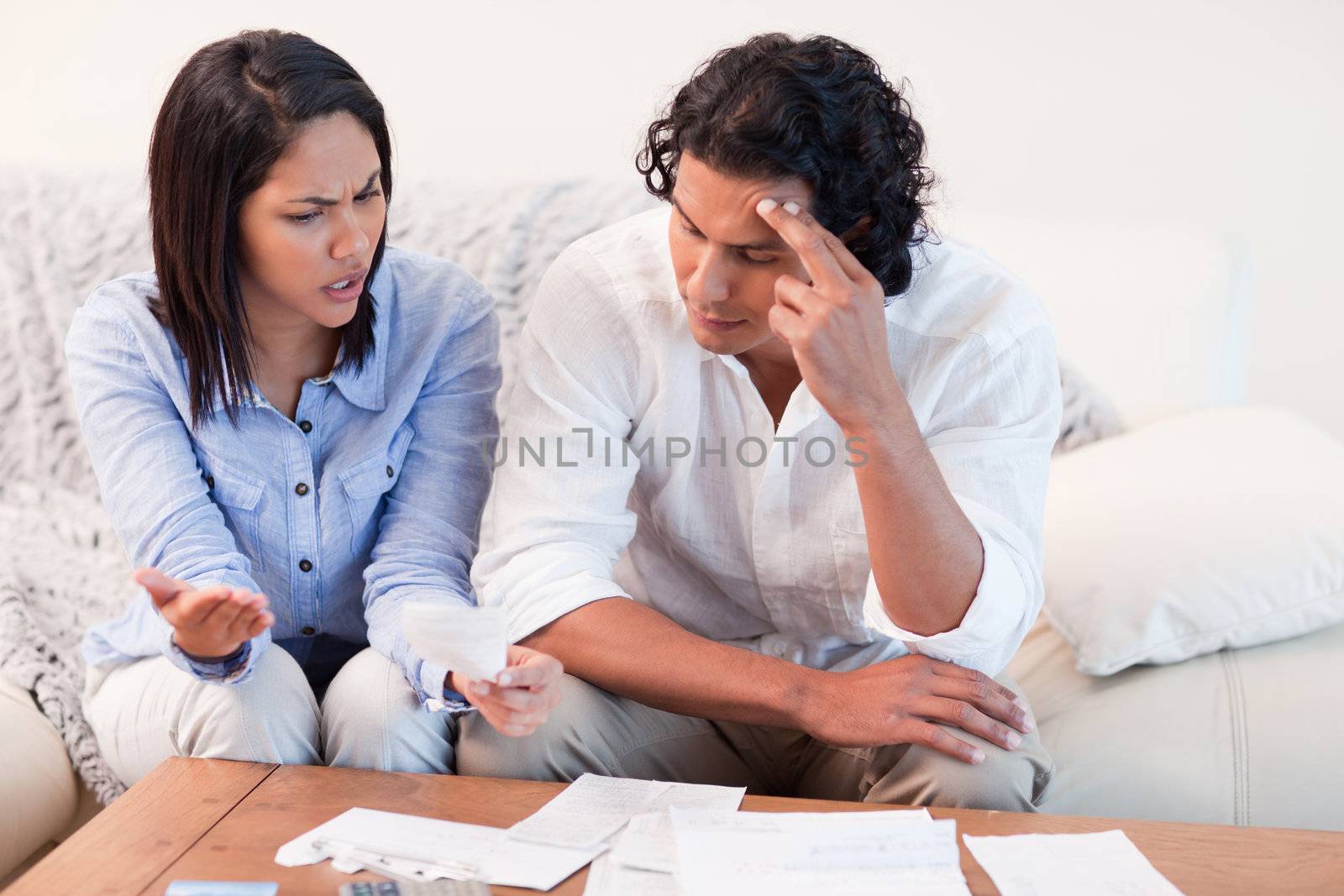 Young couple talking about financial problems