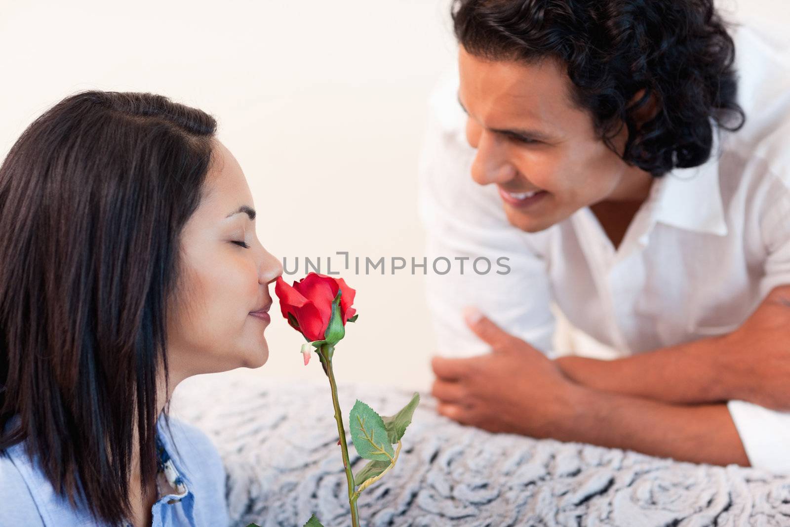 Young man just gave his girlfriend a rose