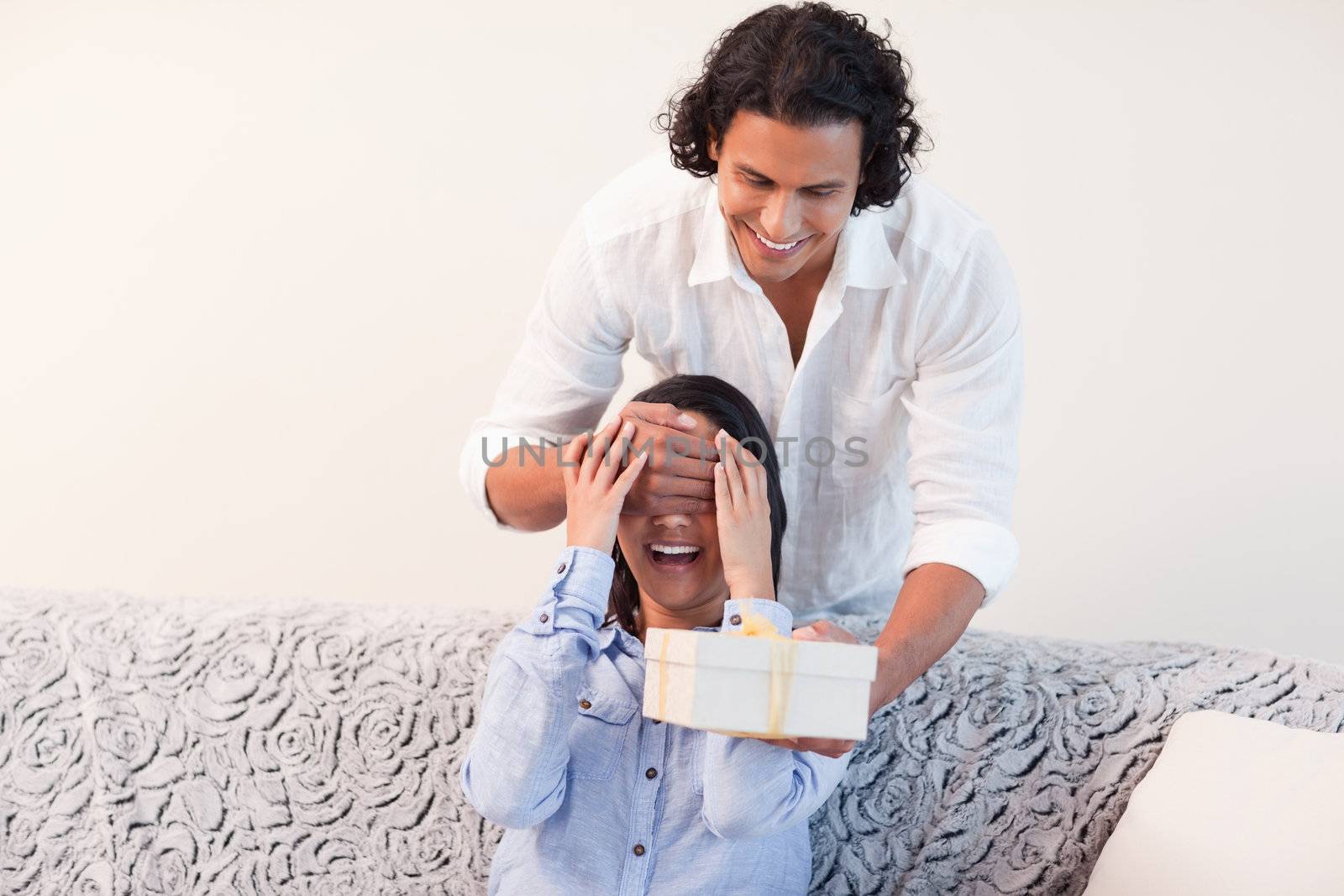 Young man having a present for his girlfriend