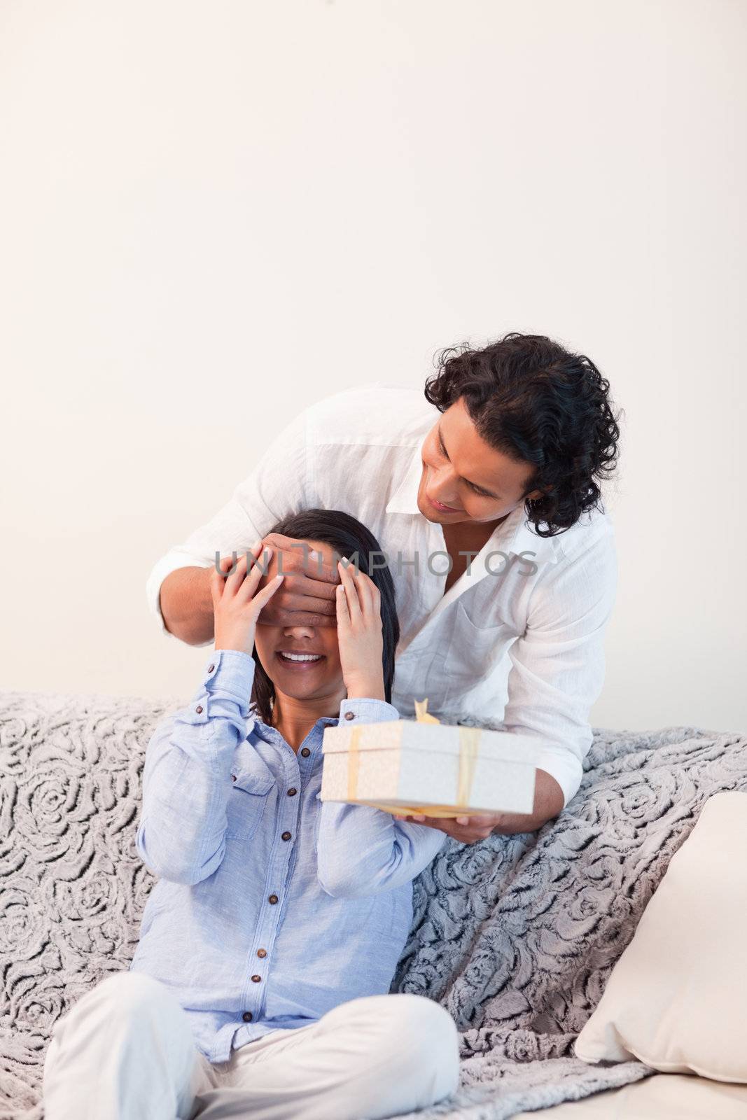 Young man having a surprise for his girlfriend
