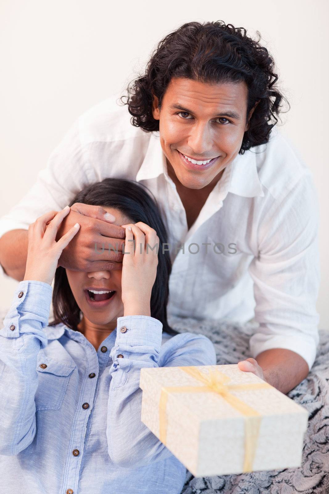 Young male having a surprise for his girlfriend