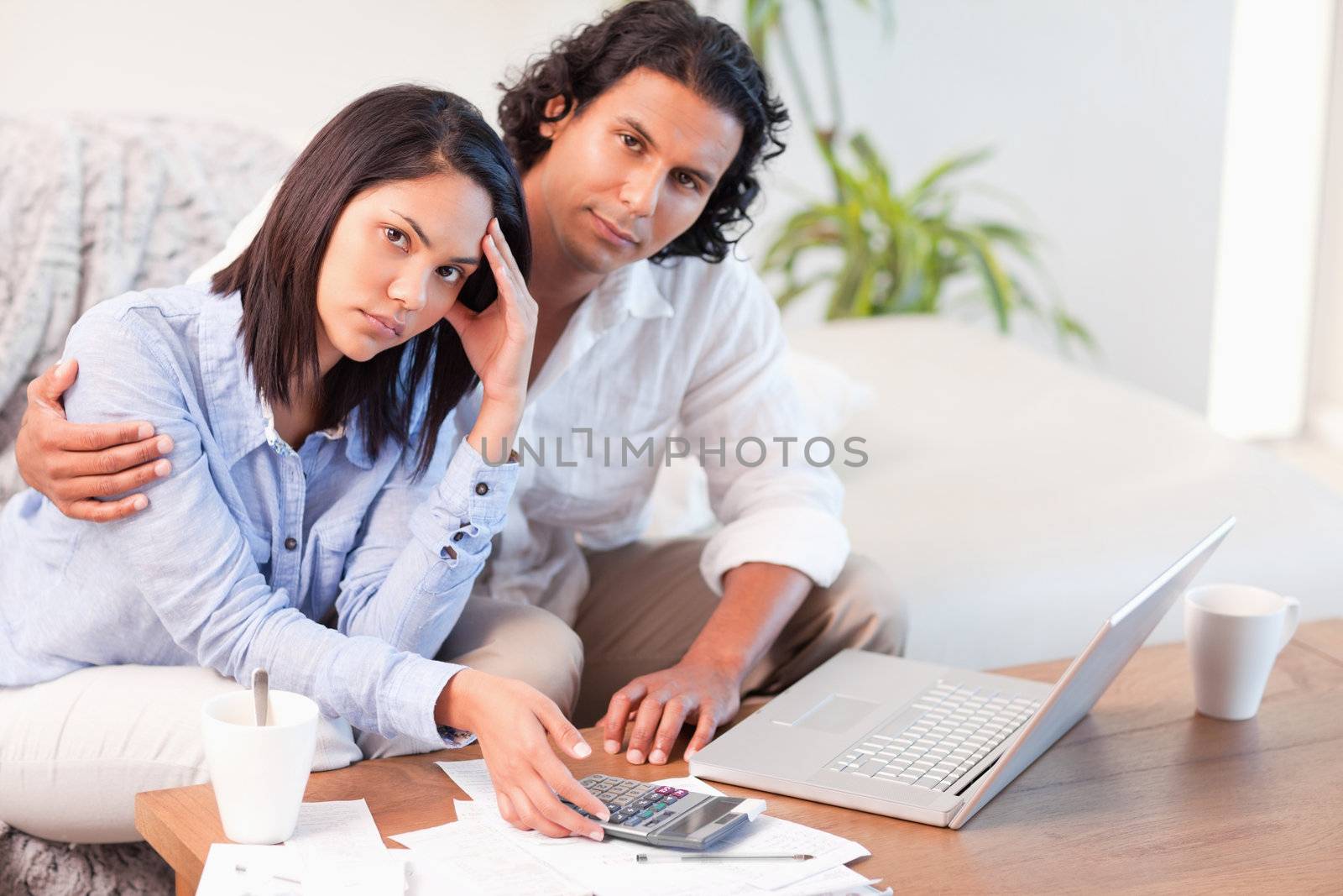 Young couple having a hard time paying their bills