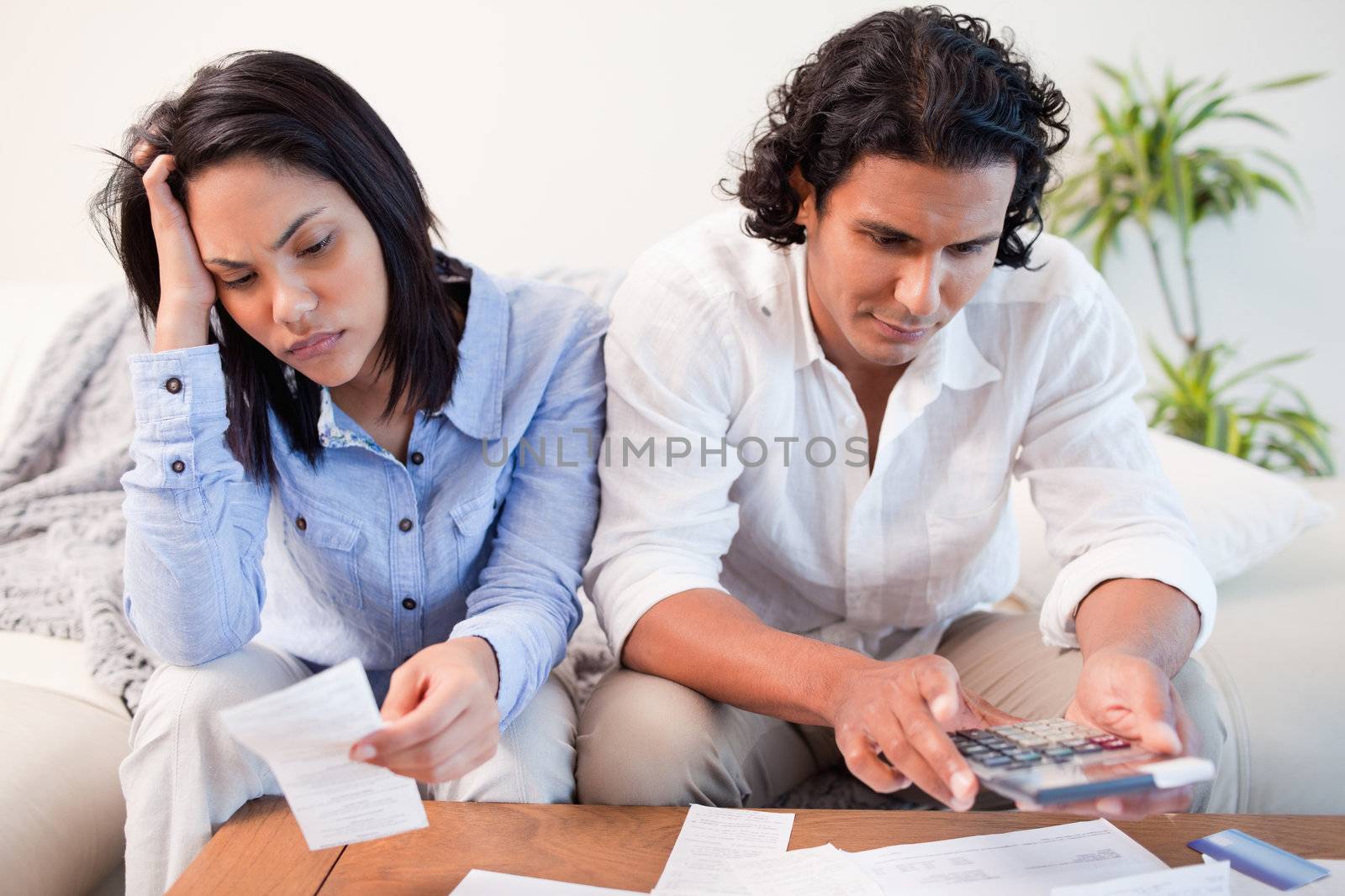 Young couple having a hard time doing their finances