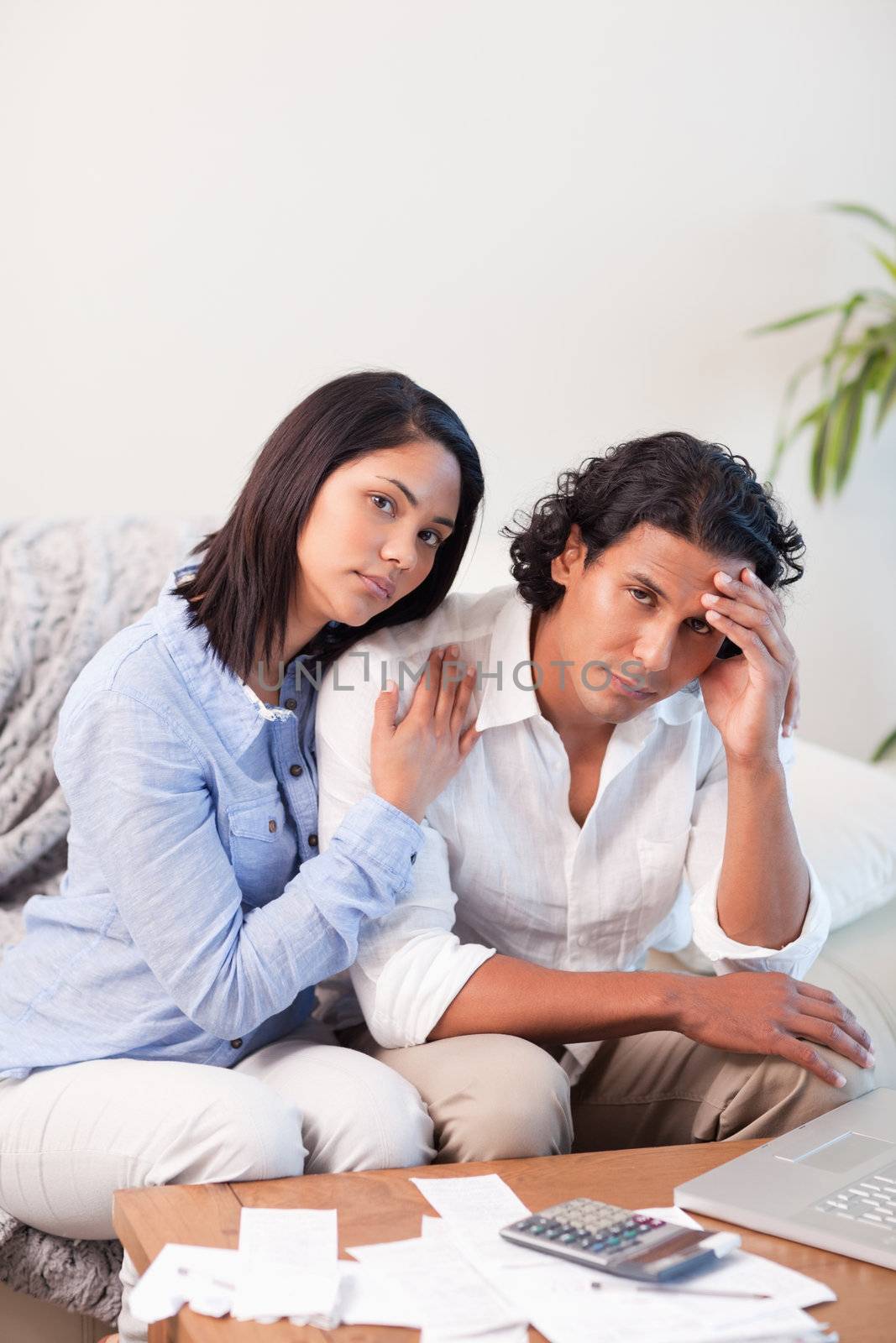 Young couple frustrated over their financial situation