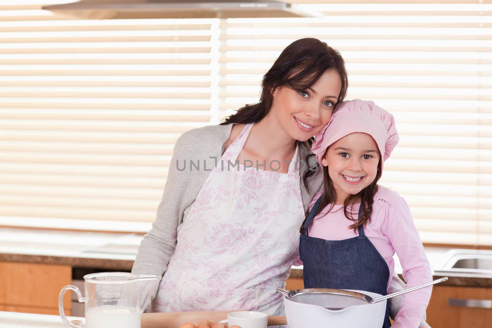 Mother and daughter baking in a kitchen