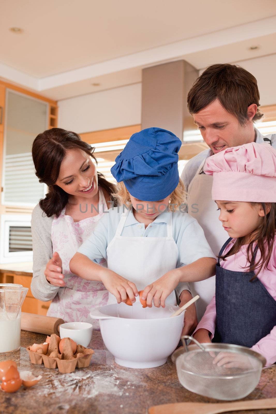 Portrait of a family baking in a kitchen
