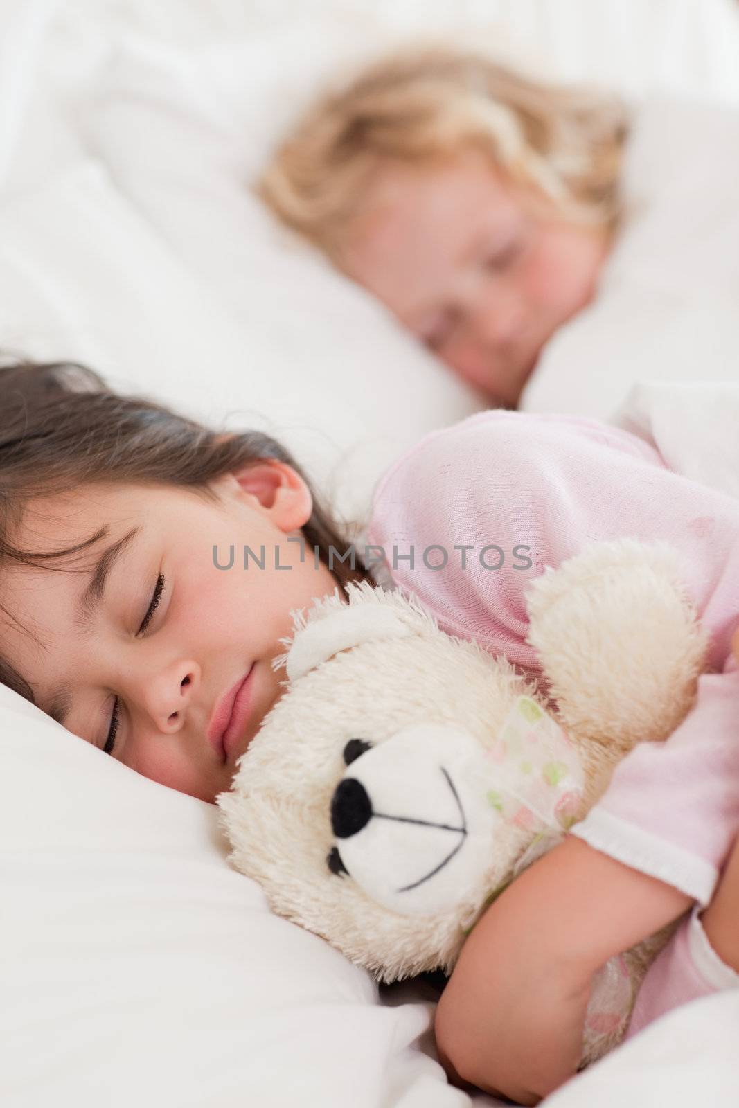 Portrait of calm children sleeping in a bedroom
