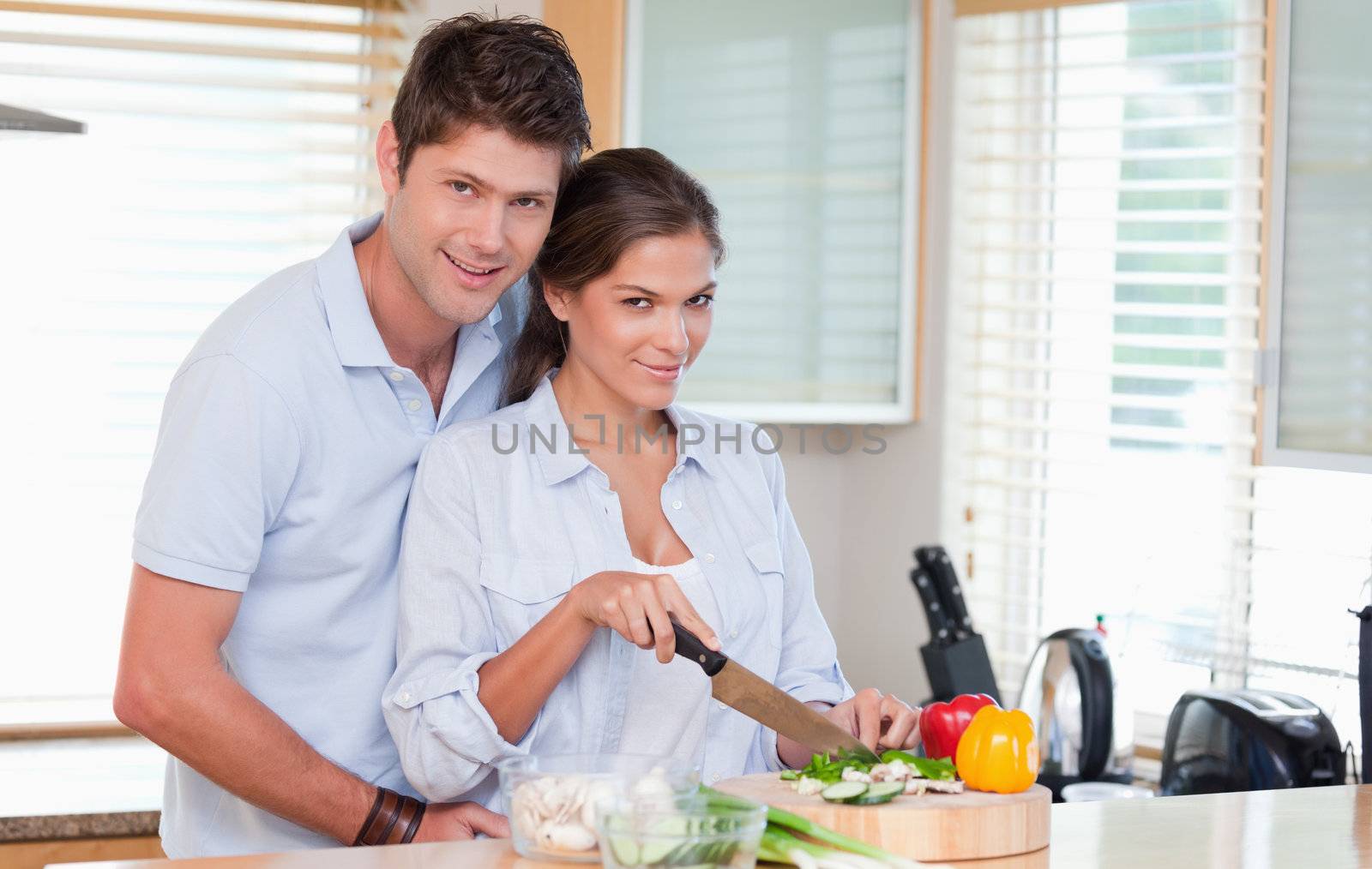 Married couple cooking in their kitchen