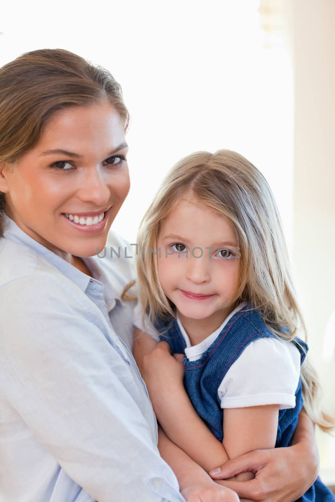 Portrait of a young mother and her daughter posing together