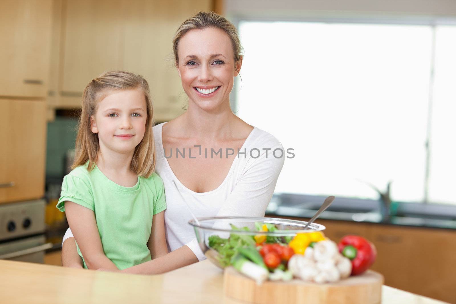 Mother and daughter in the kitchen together