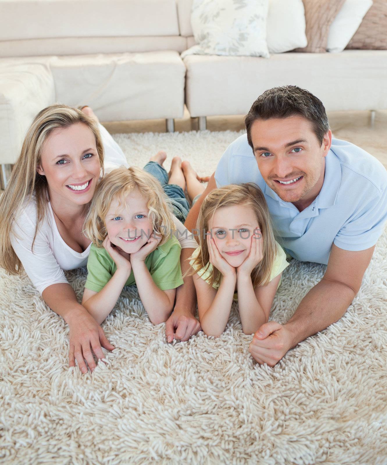 Happy family together on the floor