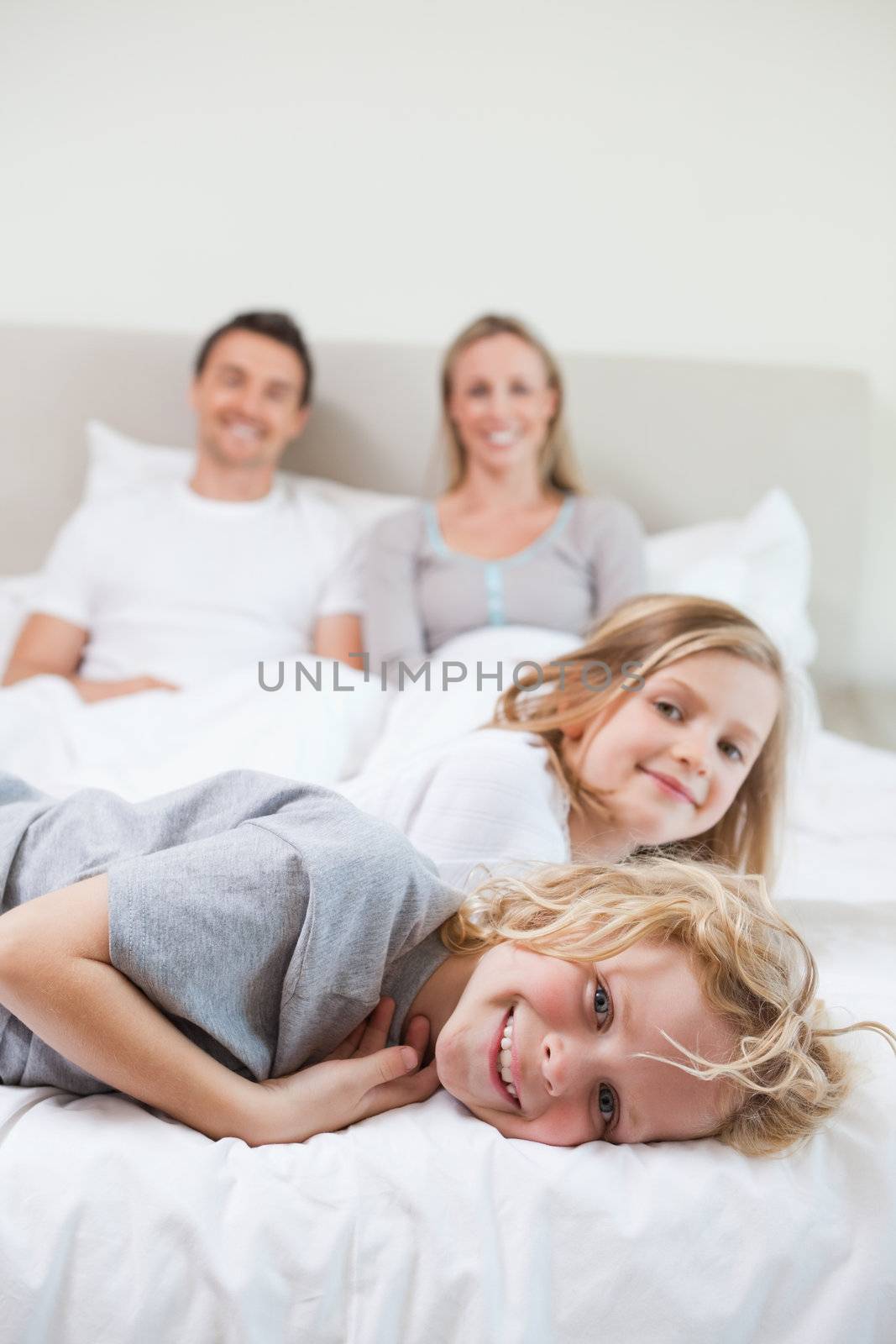 Family taking a rest together on the bed