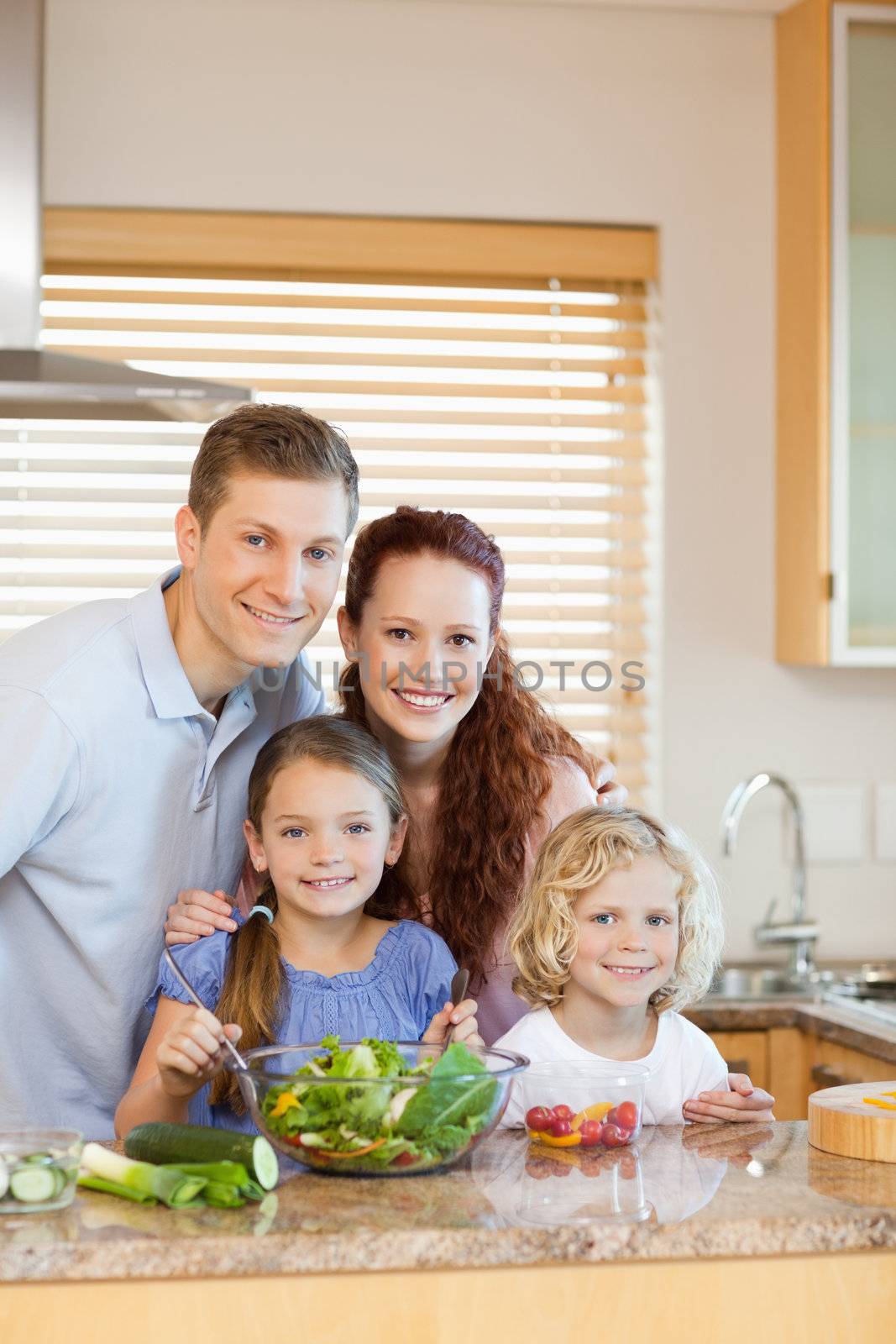 Family standing in the kitchen by Wavebreakmedia