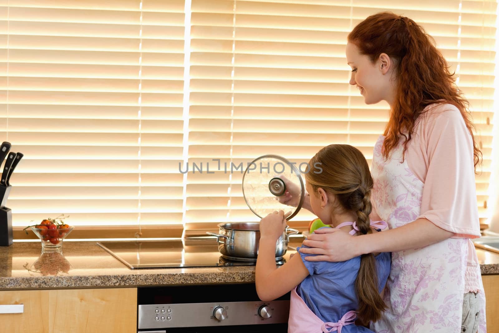 Mother and daughter cooking a meal together