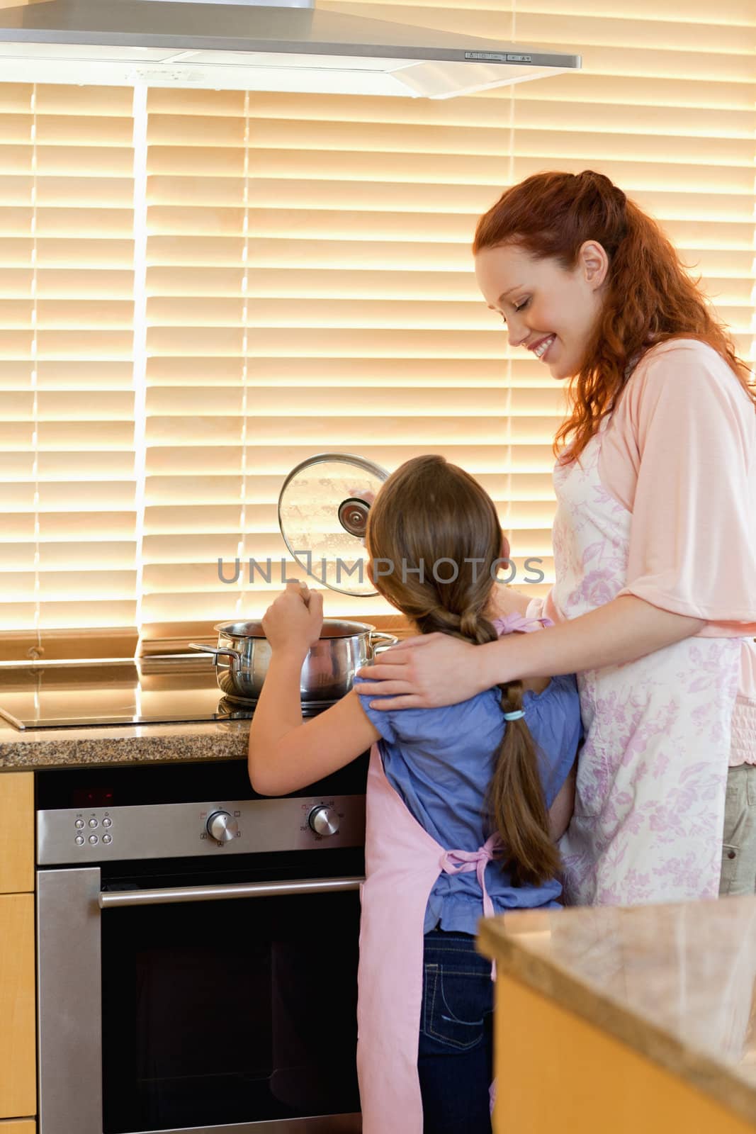 Mother and daughter preparing a meal together